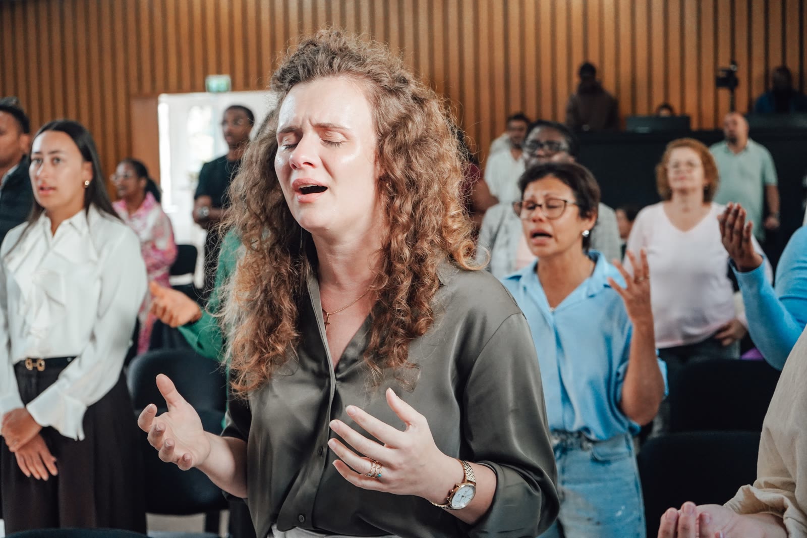 People worshipping together at River Church Frankfurt on September 27